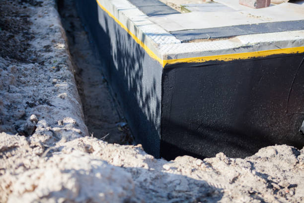 Professional Waterproofing technician working in Dry Ridge, KY